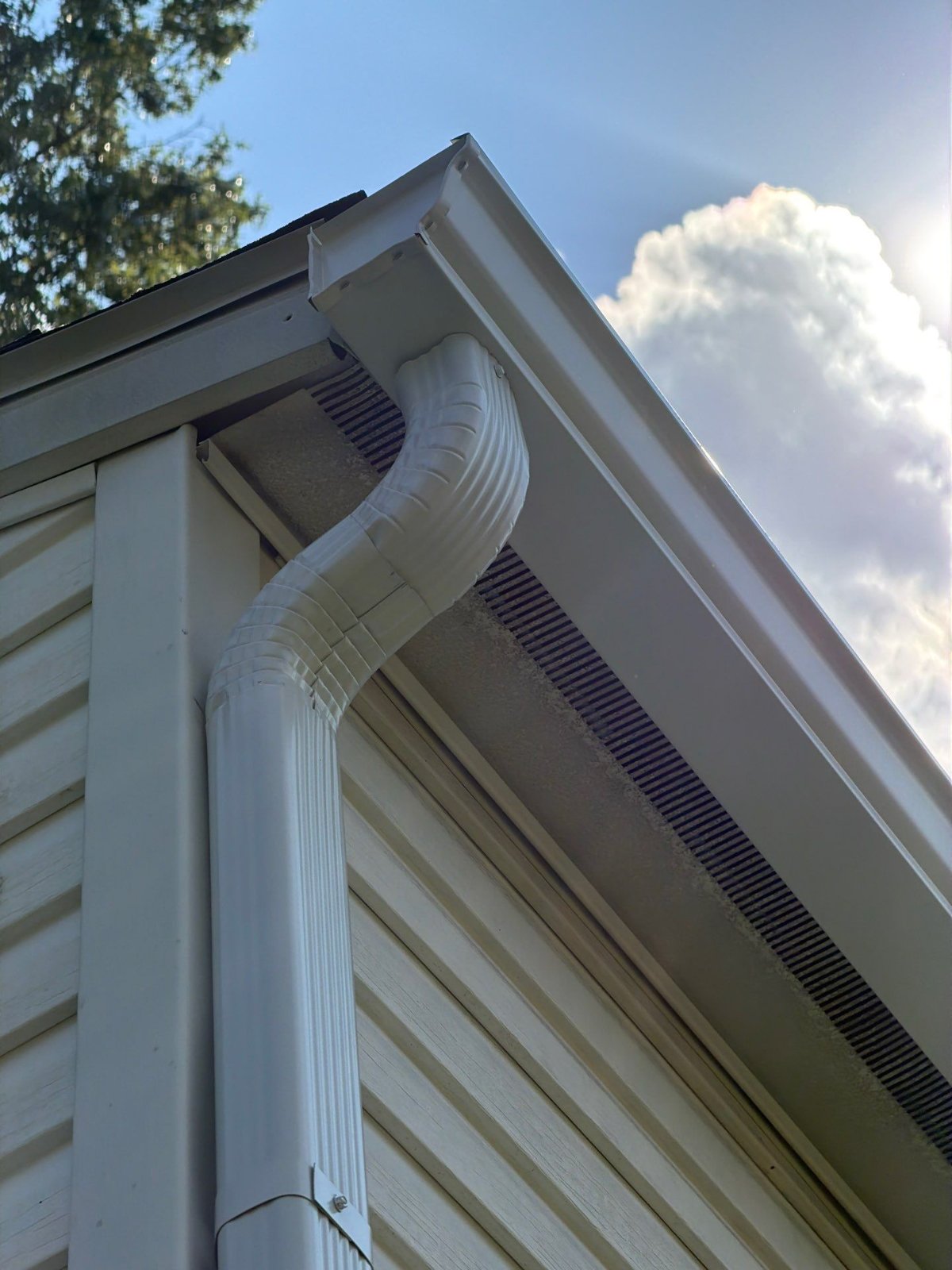 Outlet, elbows and downspout tied together tight at the corner