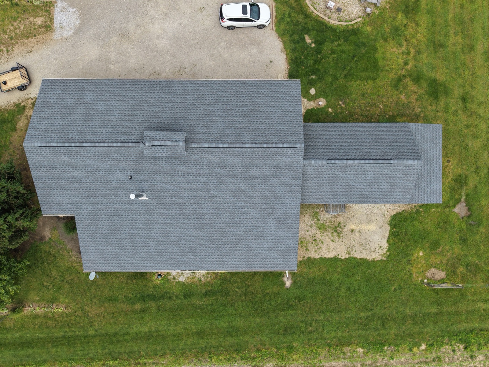 The full roof rebuilt across the structure and its wing